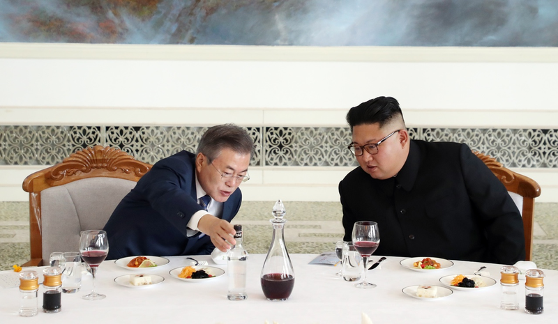 South Korean President Moon Jae-in talks with North Korean dictator Kim Jong Un during a lunch at the Okryugwan restaurant on September 19, 2018 in Pyongyang, North Korea